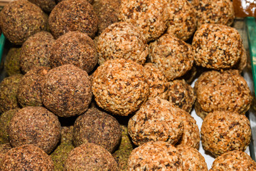 Turkish fruit and nut candy. Scattered pistachio and almond nuts.