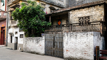 Fototapeta na wymiar Shunde, Foshan, China - April 3, 2017: old house in the small old town city in China, Asia, colonial architecture, British architecture, rich Easter Chinese culture, public streets, poverty in Asia 