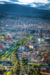 View of the city of Cuenca from the Mirador del Turi lookout, just minutes before sunset. Cuenca, Azuay Province, Ecuador, South America.