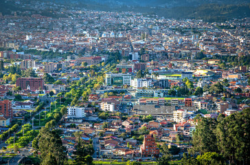 Fototapeta na wymiar View of the city of Cuenca from the Mirador del Turi lookout, just minutes before sunset. Cuenca, Azuay Province, Ecuador, South America.