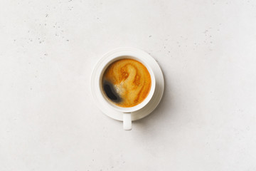 Cup of coffee espresso on white background with tablecloth, minimal