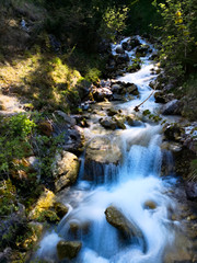 Fototapeta na wymiar flowding waterfall in the wood