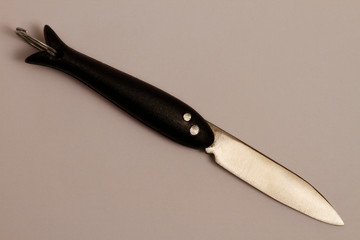 Folding knife with blade fixation on white. Folding knife for use in gardening. Folding knife...