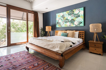 Authentic interior bedroom at comfortable house with ethnic decor