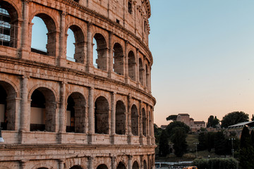 Fototapeta premium colosseum in rome italy on the sunset against the background of the landscape