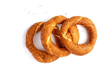 three traditional Turkish crispy bagel with sesame, on white background.Close up. sesame bread rolls