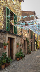Picturesque townscape of Valldemossa, Majorca (Mallorca), Spain, with colorful garlands.
