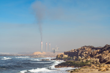 Fototapeta na wymiar industrial pipes and air pollution on the Atlantic coast