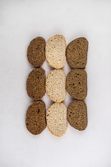 Assortment of baked bread,  Sliced bread, Fresh loaves of bread, Different kinds of fresh bread