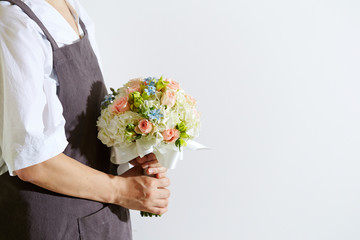 Flower bouquet in florist's hand 