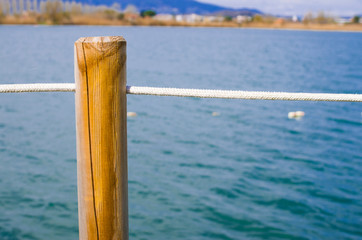 white rope on azure lake near city