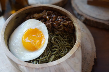 Green Noodle in a Wooden Bowl