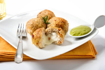 suppli fried meatballs made with rice and mozzarella from Rome cuisine in Italy