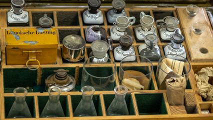 Vintage medic set. Chemical reagents in antique bottles. Vintage box