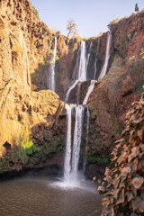 waterfall in the mountains of North Africa in the setting sun