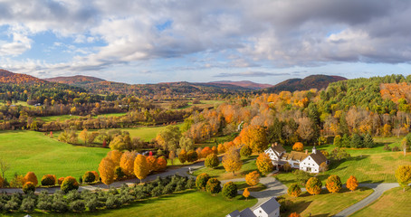 Autumn leaves on country farm road near Woodstock Vermont