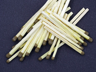 Matches and matchbox on black background