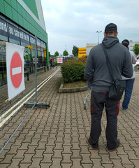 covid-19 the line in front of the store