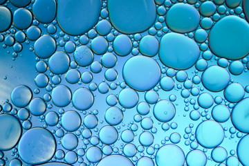 Colorful artistic of oil drop floating on the water. Abstract bubble background.
