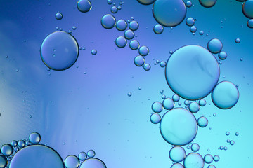 Colorful artistic of oil drop floating on the water. Abstract bubble background.