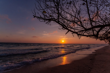 A spectacular sunrise over the Andaman sea shot from Kala Pathar Beach at Havelock Island a.k.a Swaraj Island. The tree silhouette along with the waves bashing the shore adds the character to the shot