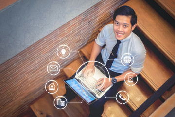 working at home self-quarantine staying safe from coronavirus COVID-19 pandemic, businessman self-isolating working in house using computer laptop internet technology to send information to colleagues