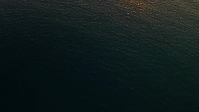 Aerial of people swimming at Tran Phu beach Nha Trang, Vietnam. A beautiful seaside promenade with plenty of luxury and mid-range beachfront resorts, souvenir shops, museums,seafood restaurants