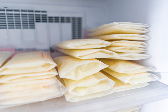 Frozen breast milk packets bags being stored in freezer refrigerator, keeping milk safe from going out of date, parenting parenthood motherhood lifestyle taking care of infant baby with responsibility