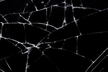 Broken black glass, with white lines on black glass.