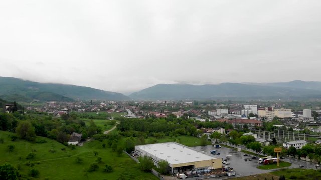 Aerial footage of the northern part of Ramnicu Valcea, the road to Sibiu, on the Olt Valley.