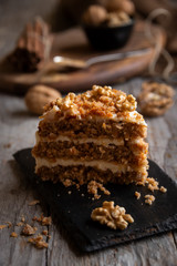 Piece of cake. Carrots and walnuts cake with creamy cheese