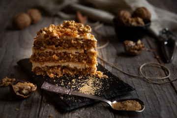Piece of cake. Carrots and walnuts cake with creamy cheese