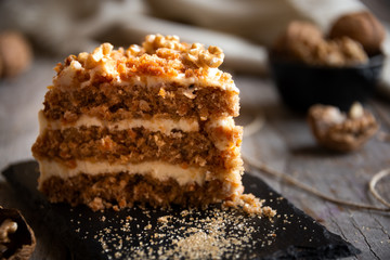 Piece of cake. Carrots and walnuts cake with creamy cheese