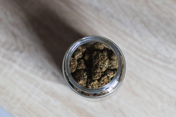 A Jar With Weed On Wooden Background