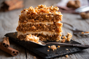 Piece of cake. Carrots and walnuts cake with creamy cheese