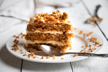 Piece of cake. Carrots and walnuts cake with creamy cheese