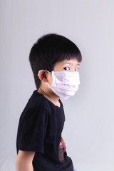 Little boy wearing mask for protect
