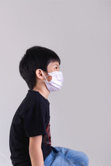 Little boy wearing mask for protect