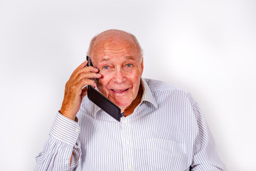 elderly man talks with his family by mobile