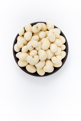 Yogurt Cashew nuts in round bowl on white background, top view