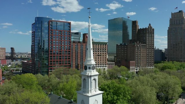 flying clockwise around Trinity Church steeple in downtown Newark