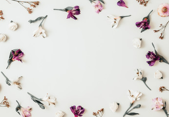 White and purple floral frame composition, flat lay, grey neutral background, space for text or product in center