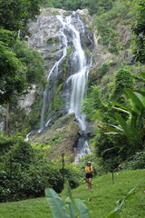 Women enjoying nature at Klong Lan waterfall in Klong Lan national park at Kamphaeng Phet, Thailand	