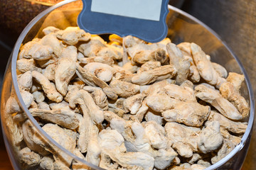Dried turmeric (curcuma) and dried ginger root background for sale in Istanbul grand bazaar market.