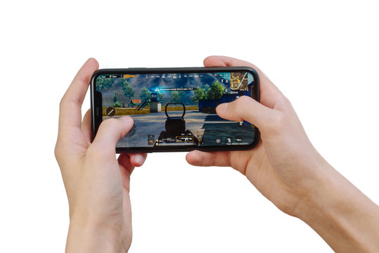 Samara Russia - 04.05.2020: Hands holding a smartphone Iphone 11 with PUBG mobile game on display screen, Illustrative Editorial