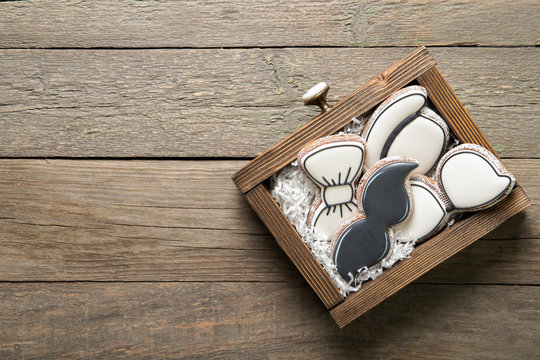 Happy father's day concept. Tasty cookies in a box on a wooden background. Place for text - Powered by Adobe