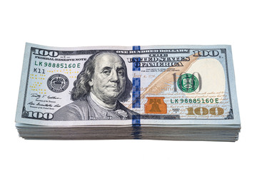 A pack of hundred-dollar bills. A pile of American dollars banknotes isolated on a white background.