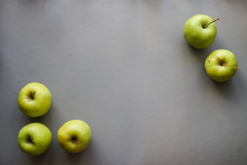green apples on gray background
