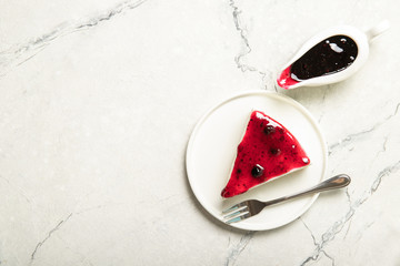 Plate with homemade jam cheesecake.Place for text.