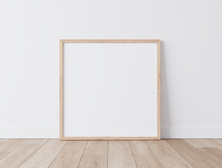 Wooden square frame Standing on parquet floor with white background, minimal frame mock up interior 